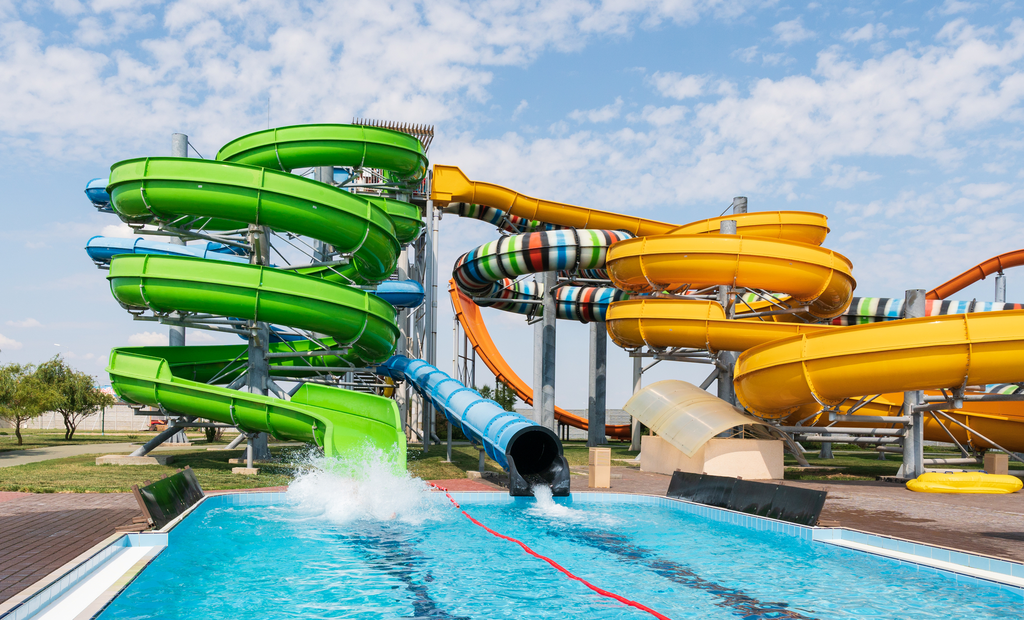 Water park with colorful slides and pools.